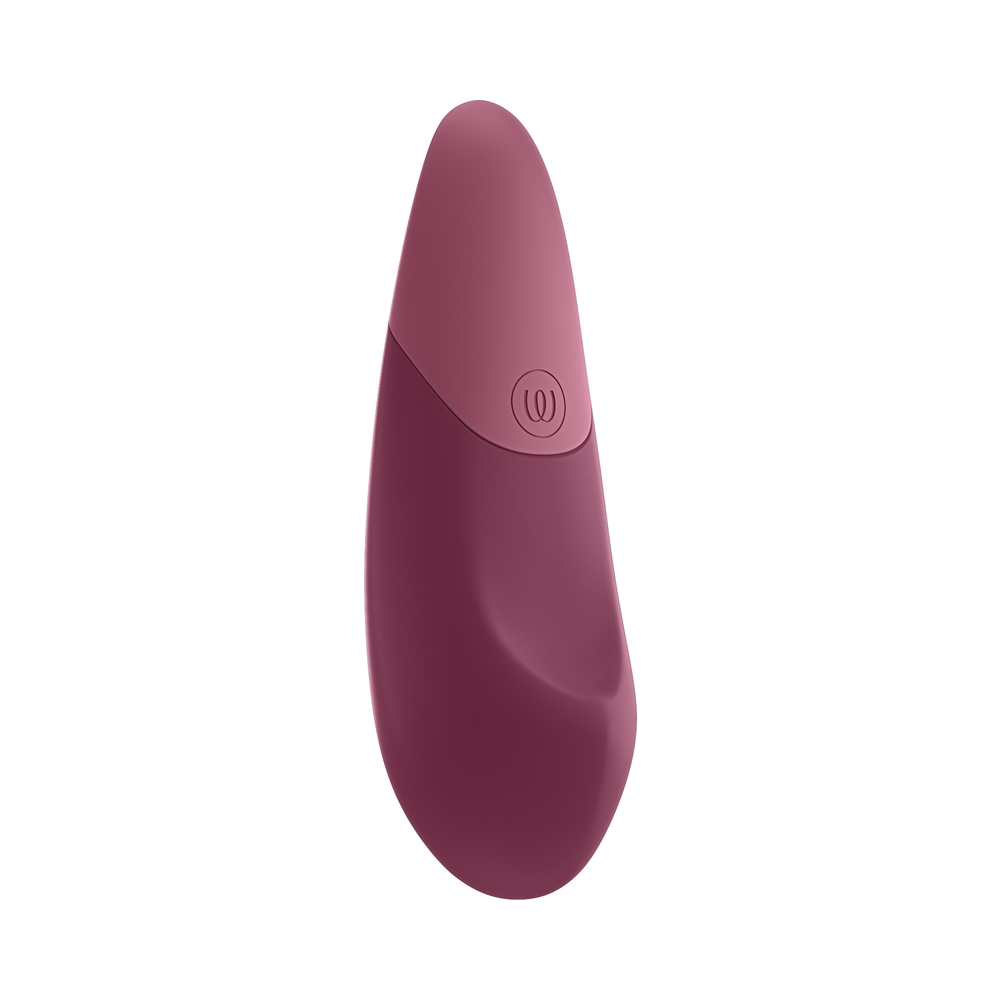 Pink Womanizer vibrator Dusky shown in hand for scale