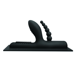 Cowgirl vibrator BuckWild Attachment shown in hand for scale