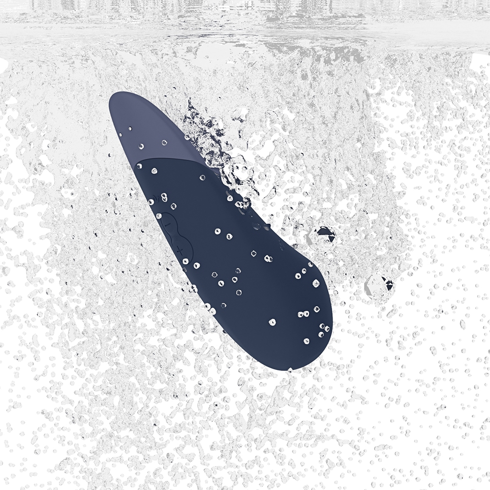 Fully assembled Dark Blue Womanizer vibrator with smooth exterior