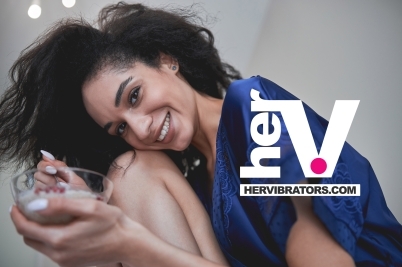 bottle of women’s anal sex lube displayed with soft lighting to represent gentle smooth lubrication for women