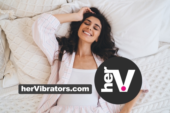 Best vibrators for her guide 2026 with a woman smiling in cozy bedding
