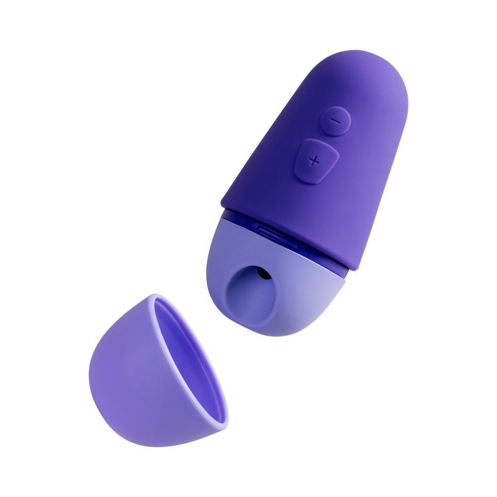 ROMP vibrator Free X shown in hand for scale