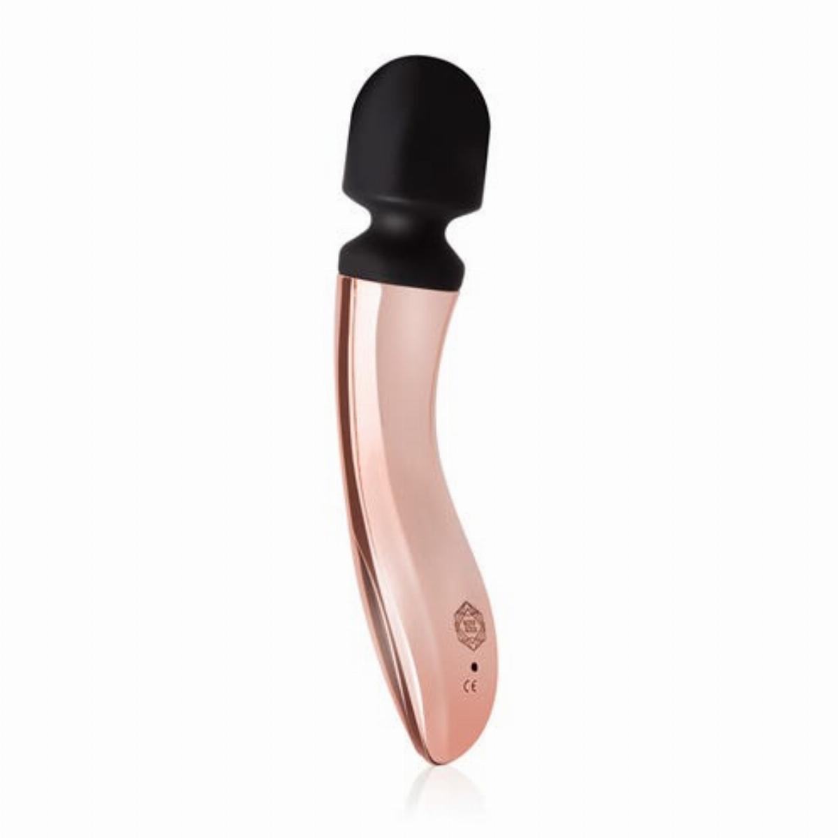 Gold Rosy Gold vibrator Nouveau Curve shown in hand for scale