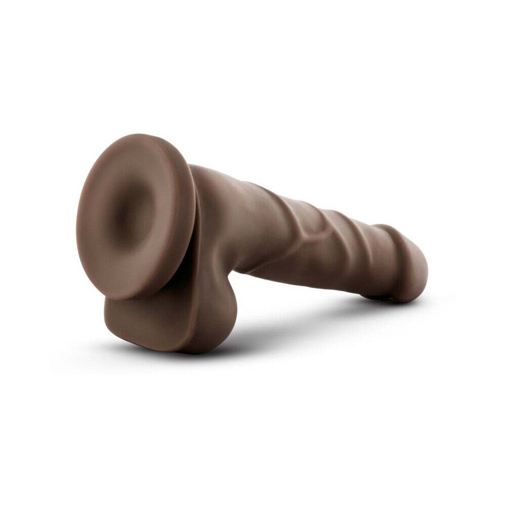 7.75 inch Dildo by Blush in Dark Brown shown for pegging Her or Him