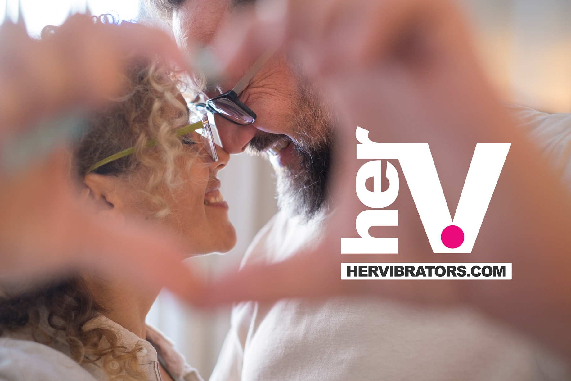 Romantic couple smiling closely together while exploring connection and intimacy with a strap on in a loving adult relationship