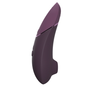Purple Womanizer vibrator Next Dark shown in hand for scale