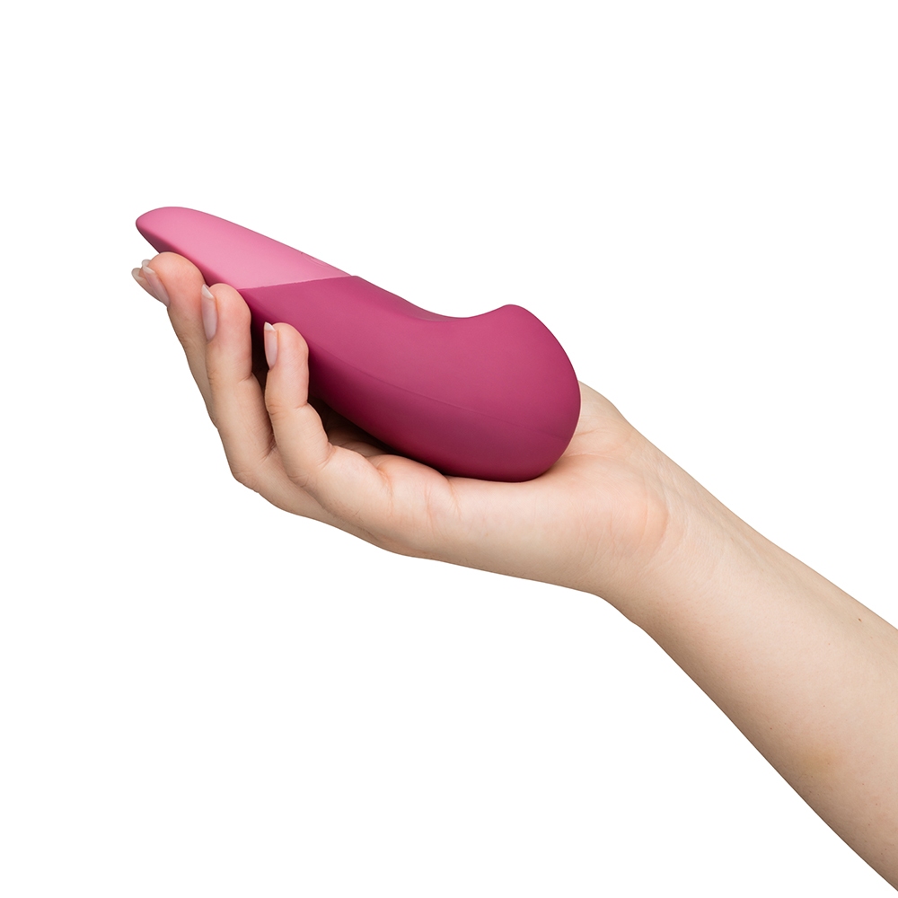 Angled view of the Pink Womanizer vibrator designed for intimate use