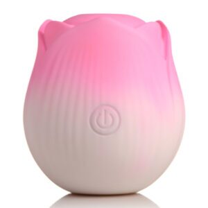 Pink XR Brands vibrator Bloomgasm Pulsing Petals Throbbing Rose Stimulator shown in hand for scale