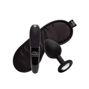 Fifty Shades of Grey vibrator Fifty Shades X We- Come to Bed 3pc Couple's Kit shown in hand for scale