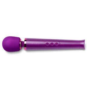 Le Wand vibrator Petite Dark Cherry shown in hand for scale
