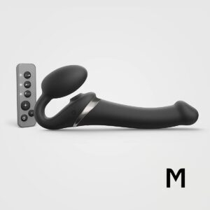 Black Strap-On-Me vibrator Orgasm Medium Bendable Strap-On shown in hand for scale