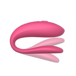 Pink We-Vibe vibrator Sync Lite shown in hand for scale