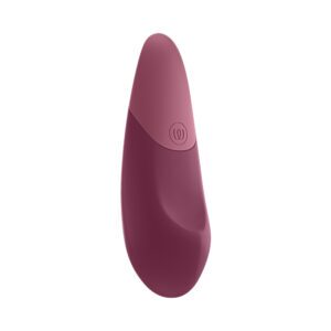 Pink Womanizer vibrator Dusky shown in hand for scale