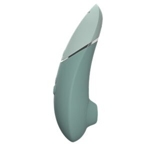 Womanizer vibrator Next Sage shown in hand for scale