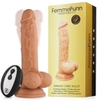 Cream Femme Funn vibrator Wireless Turbo Baller shown in hand for scale