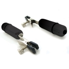 Sex Kitten vibrator Nipple Clamps shown in hand for scale