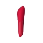 Red We-Vibe vibrator Tango X Cherry shown in hand for scale