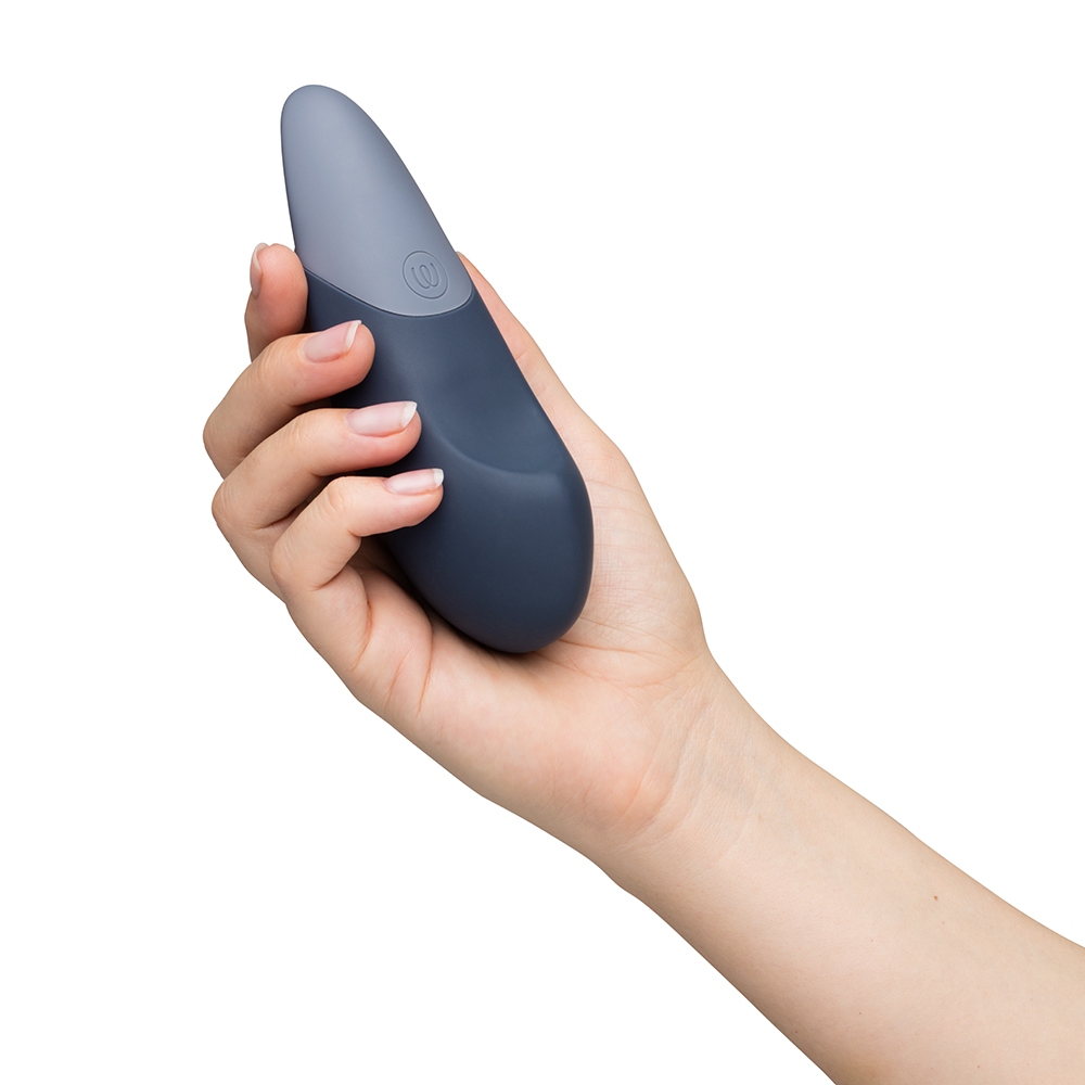 Angled view of the Dark Blue Womanizer vibrator designed for intimate use