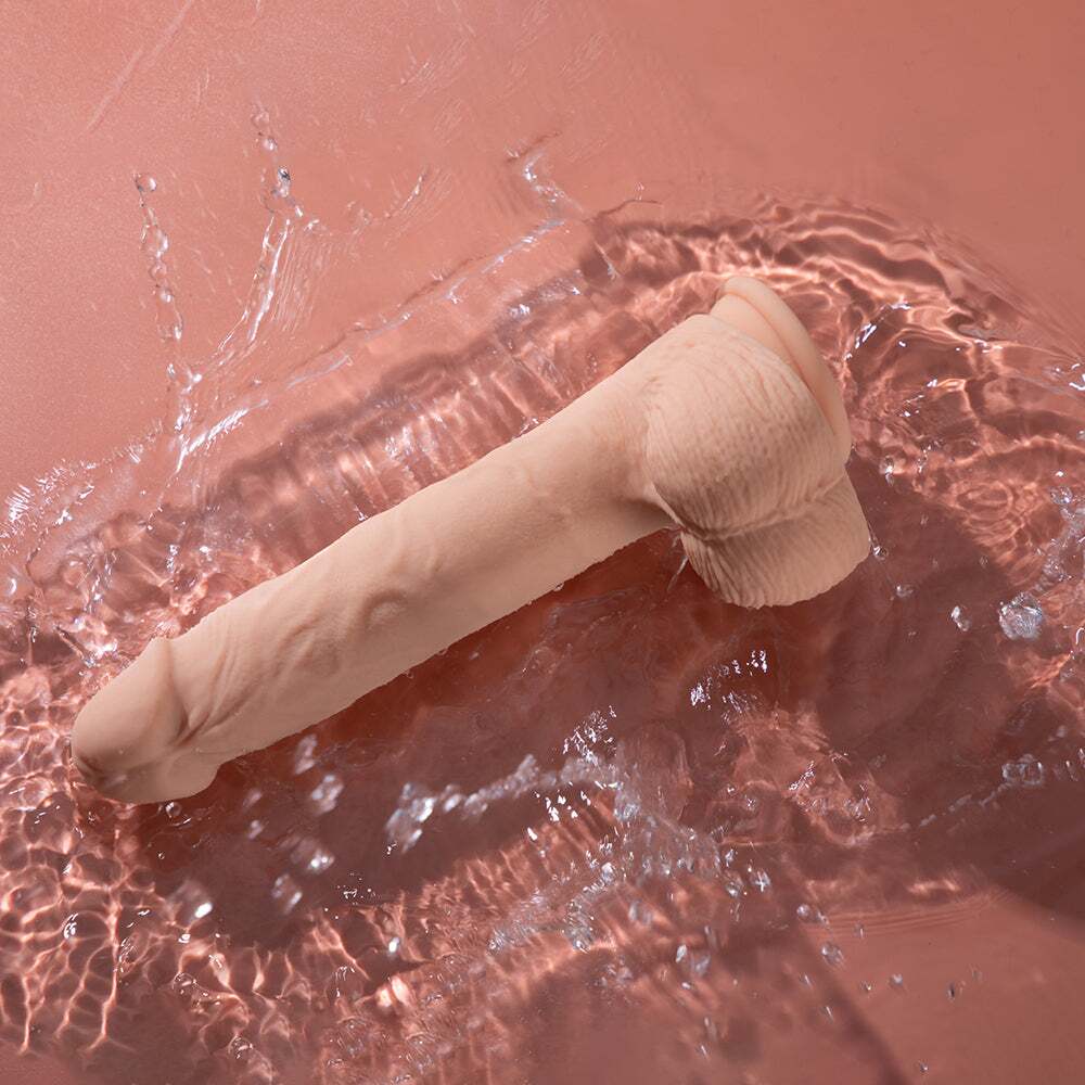 9.5 inch Dildo by Honey Play Box in Vanilla Ivory Beige displayed for pegging Him or Her