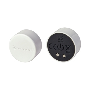 White Black Banana Pants vibrator Puck shown in hand for scale