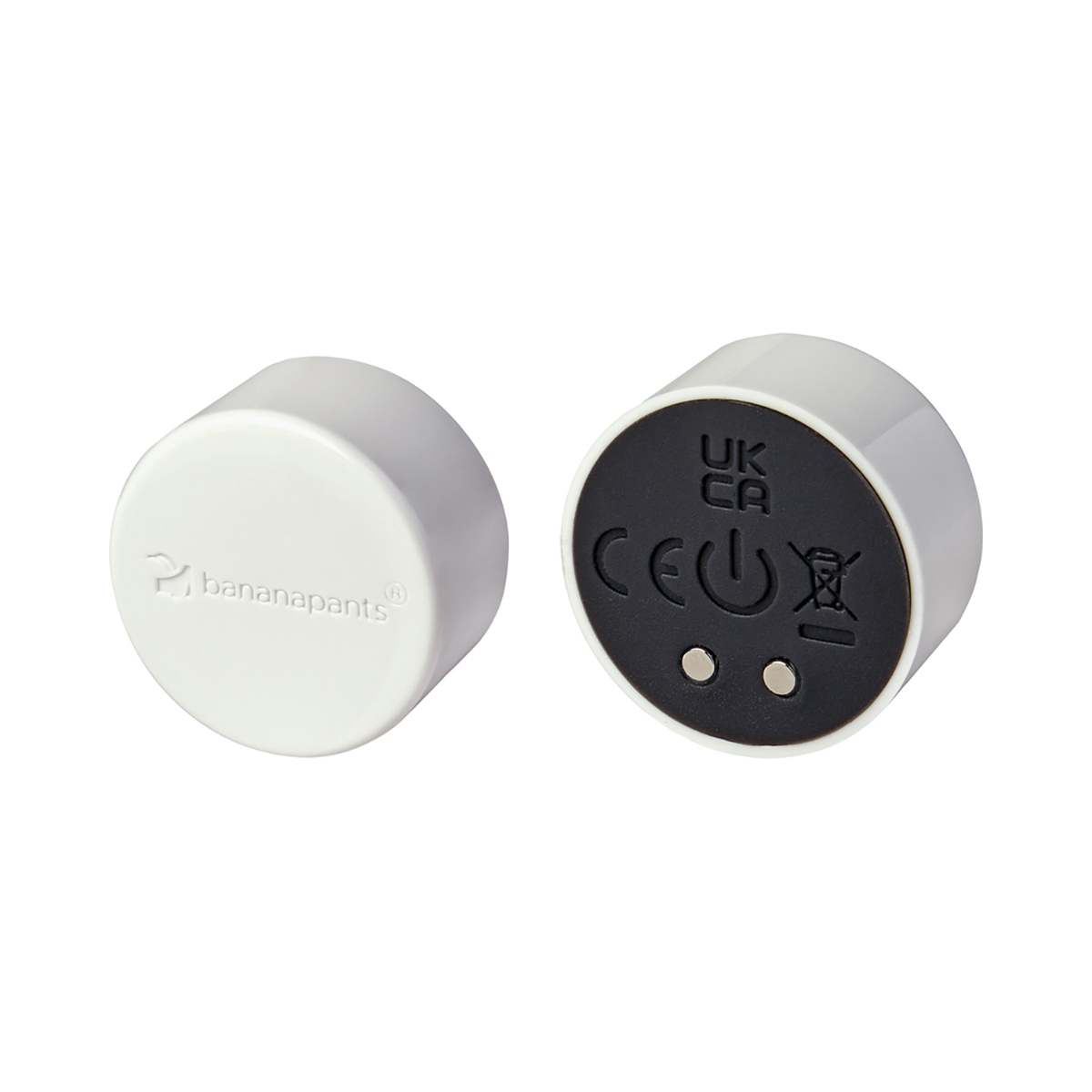 White Black Banana Pants vibrator Puck shown in hand for scale