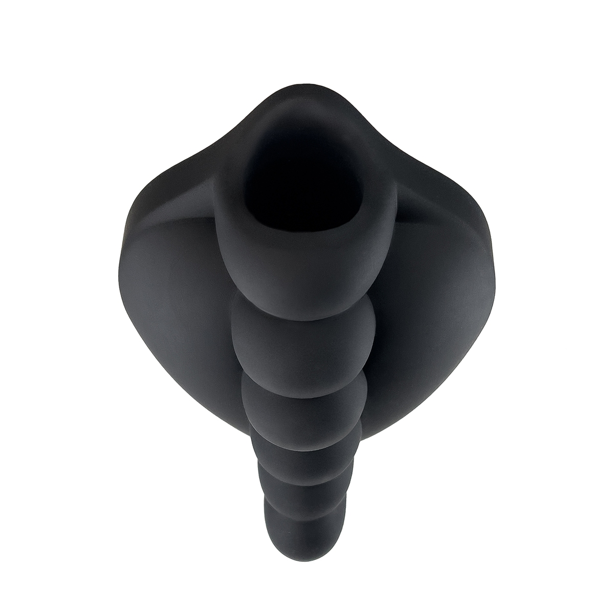 Lifestyle shot featuring the Black Banana Pants vibrator beside the bed