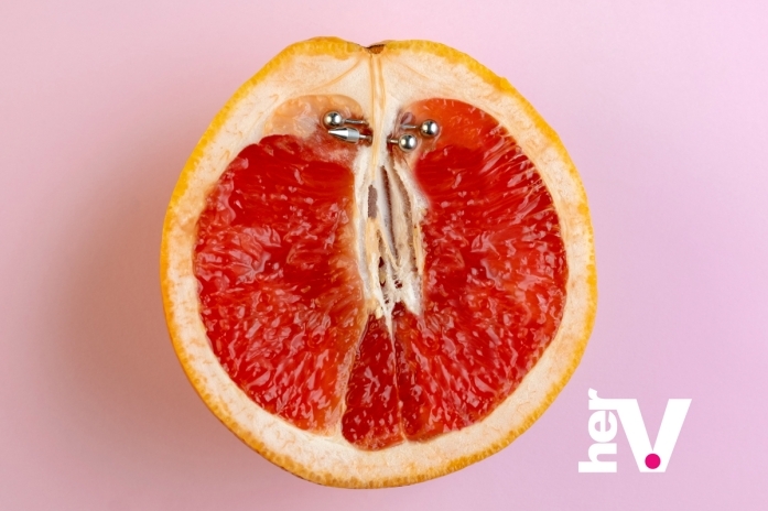 Symbolic grapefruit illustration showing huge clit anatomy and big clitoris piercing concept in clitoral anatomy discussions