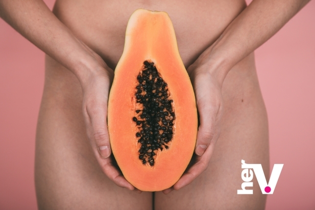 Papaya used as symbolic illustration of huge clit anatomy, big clitoris size variation, and enlarged clitoris diversity