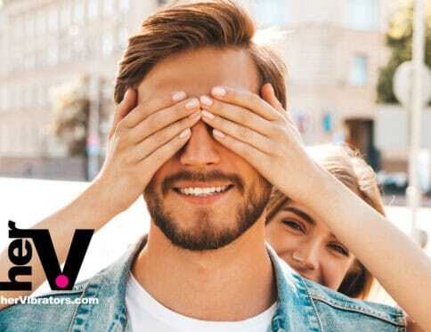 A couple engaging in intimate exploration with a strap-on harness, symbolizing trust and new sexual experiences.