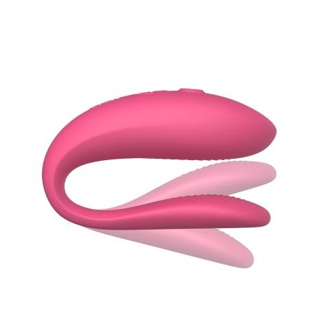 Pink We-Vibe vibrator Sync Lite shown in hand for scale