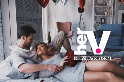 A Valentine’s Day vibrator gift styled romantically with candles and soft textures.