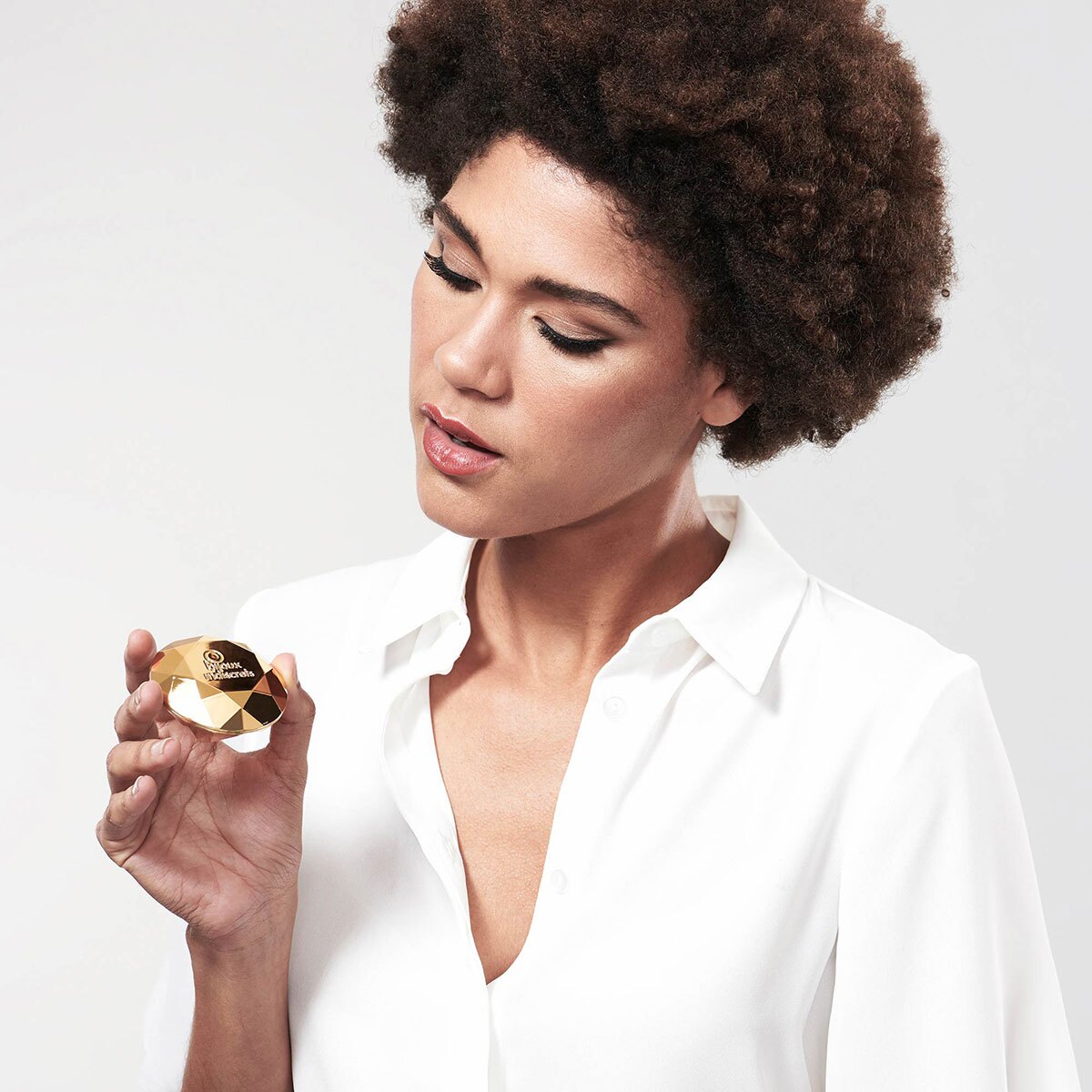 Bijoux Indiscrets vibrator Twenty One Diamond shown in hand for scale