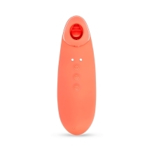Coral Nu Sensuelle vibrator Trinitii 3-In-1 Suction Tongue shown in hand for scale