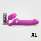 Multi Strap-On-Me vibrator Orgasm XL Bendable Strap-On Fuchsia shown in hand for scale