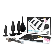 Black B-Vibe vibrator Anal Training Set shown in hand for scale