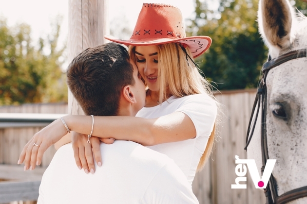 Cowgirl sex position guide showing a confident partner-led position with playful energy and intimacy