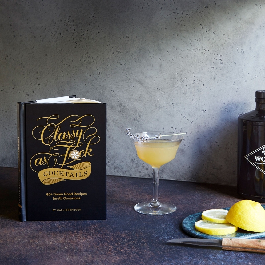 Buy  classy as fuck cocktails book for her.