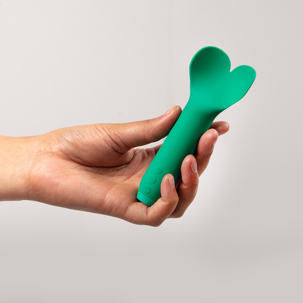 Angled view of the Green Je Joue vibrator designed for intimate use