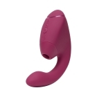 Pink Womanizer vibrator Next Duo Dusky shown in hand for scale
