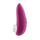 Pink Womanizer vibrator Starlet 3 shown in hand for scale