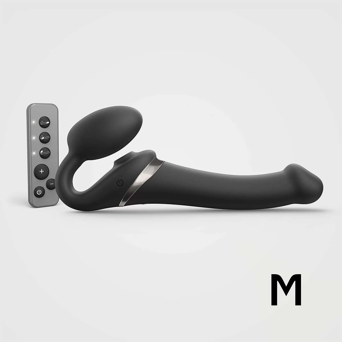 Black Strap-On-Me vibrator Orgasm Medium Bendable Strap-On shown in hand for scale