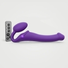 Purple Strap-On-Me vibrator Medium shown in hand for scale