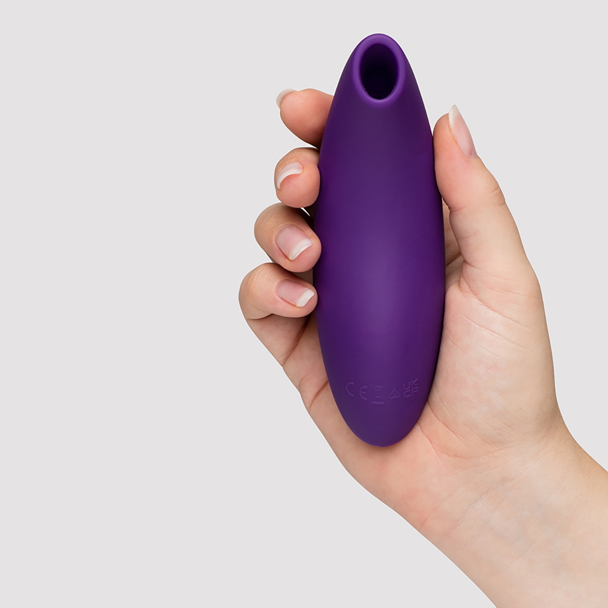 Lifestyle shot featuring the Purple We-Vibe vibrator beside the bed