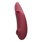 Womanizer vibrator Next Sensual Collection Bordeaux shown in hand for scale