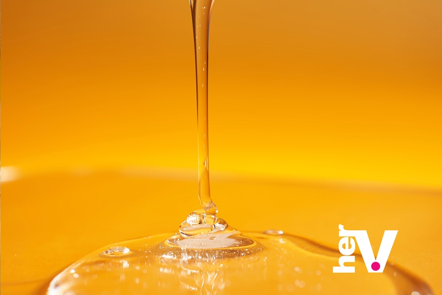 Silicone sex lube buying guide image showing a smooth liquid pour, representing how to choose the best silicone sex lubricant for long-lasting glide.