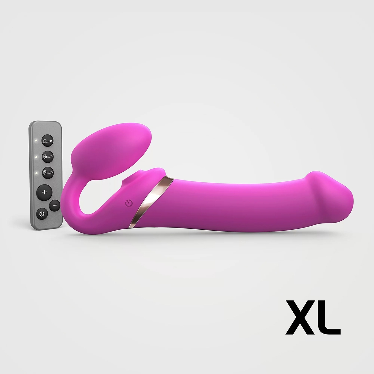Multi Strap-On-Me vibrator Orgasm XL Bendable Strap-On Fuchsia shown in hand for scale